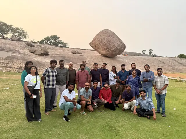 The team on the grass below Krishna's Butter Ball, the giant balancing boulder at Mahabalipuram, at sunset