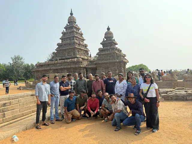 The team gathered in front of the Shore Temple at Mahabalipuram